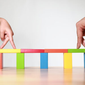 Building block bridge with walking hands