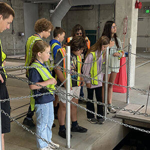 Group of children and adults on a wastewater treatment plant tour.