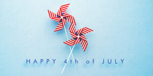 happy forth of july text with red, white and blue pinwheels on a blue background