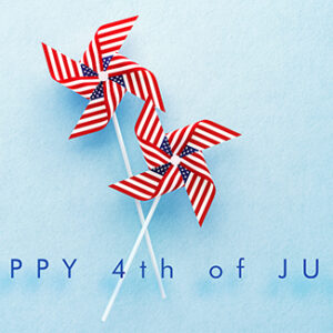 happy forth of july text with red, white and blue pinwheels on a blue background