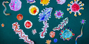 Collage of children's drawings of colorful microbes