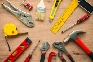Construction tools laid out in a circle on a work table top