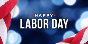 red, white and blue banner that says Happy Labor Day.